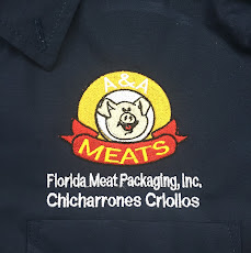 Custom embroidered logo on a navy work polo for A&A Meats.