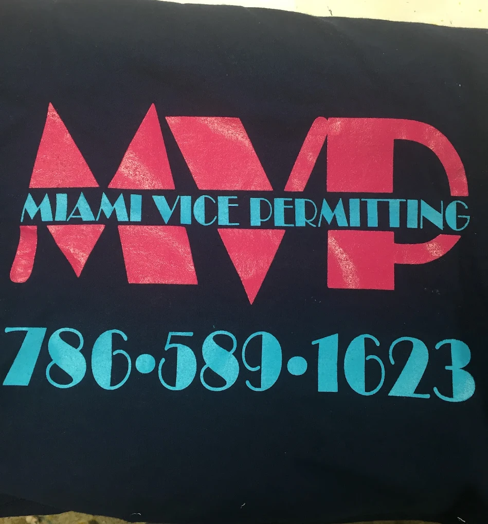 Screen-printed MVP Miami Vice Permitting design on a navy tee.