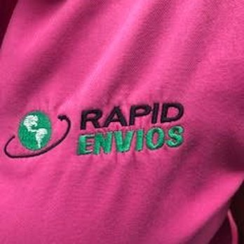 Embroidered Rapid Envios logo on a pink polo.